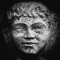 Face on large plant pot